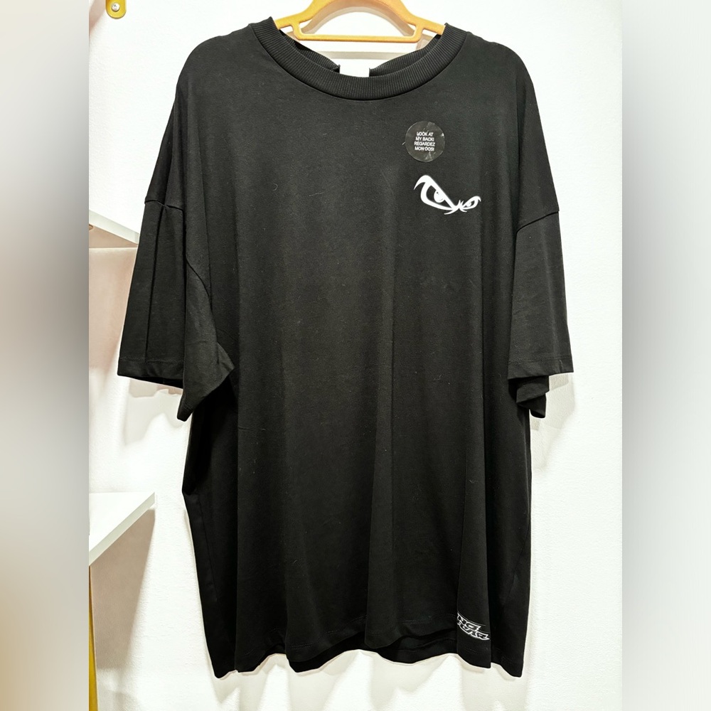 Black H&M x No Fear Tshirt with small logo on front and saying on back